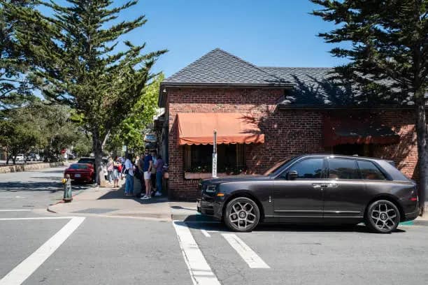 luxury SUV in front of house in carmel